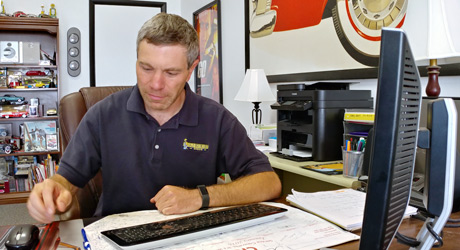 Chris Quintiliani at Desk Old Hickory Sheds Cody WY
